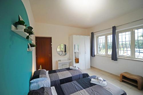 Postel nebo postele na pokoji v ubytování La cornice di Tivoli