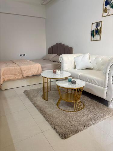 a living room with a couch and a table at Elegant Escape , the complete home in Pune