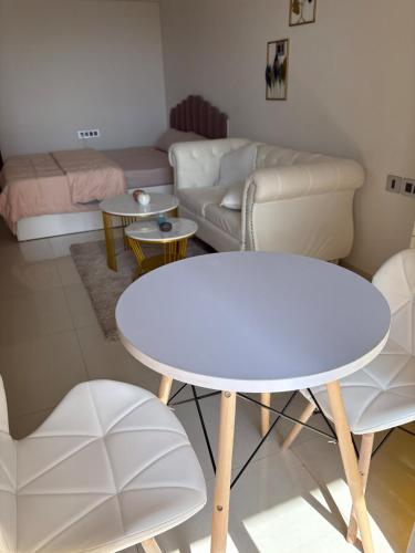 a living room with a table and a couch at Elegant Escape , the complete home in Pune