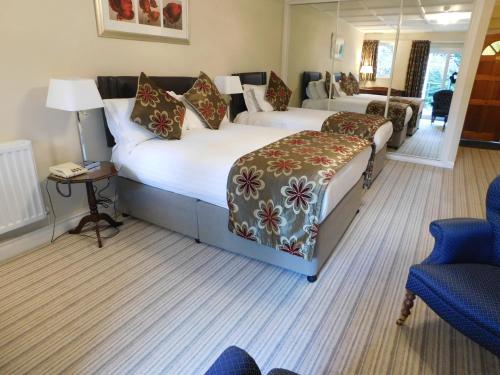Burn How Garden Hotel - Bowness on Windermereにあるベッド