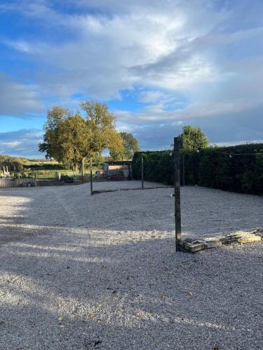 a fence in the middle of a parking lot at Home Farm & Lodge in Bawtry