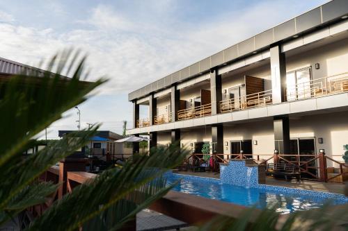 a view of a building with a swimming pool at Yasmin Luxury Resort in Paramaribo