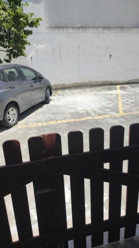 a car is parked in a parking lot at Casa Amar Cabo Frio in Cabo Frio