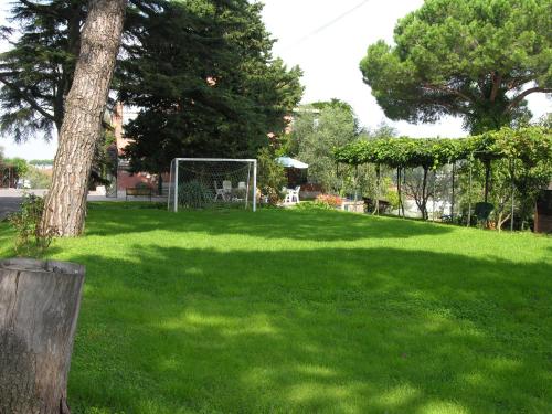 a field of green grass with a soccer goal at Vigna Licia in Pomezia