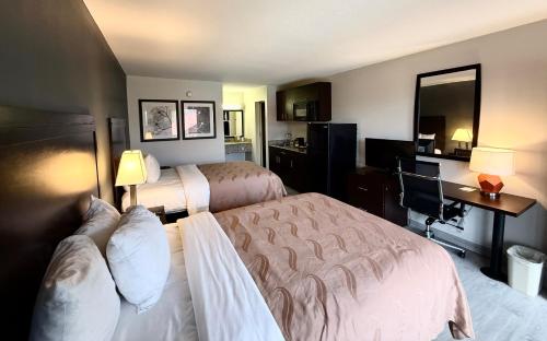 Ένα ή περισσότερα κρεβάτια σε δωμάτιο στο Quality Inn & Suites Baton Rouge West - Port Allen