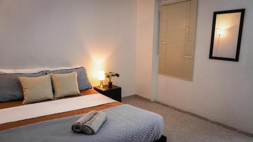 Giường trong phòng chung tại Casa MoraZ