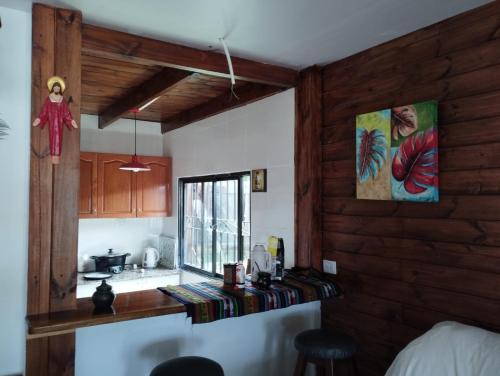 a kitchen with a counter and a sink and a window at Casa en San Pedro de Colalao in San Pedro de Colalao