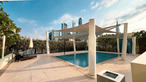 a swimming pool in the middle of a building at High-Floor Luxe 2BR Stunning Burj Khalifa & Fountain Views Direct Dubai Mall Access in Dubai