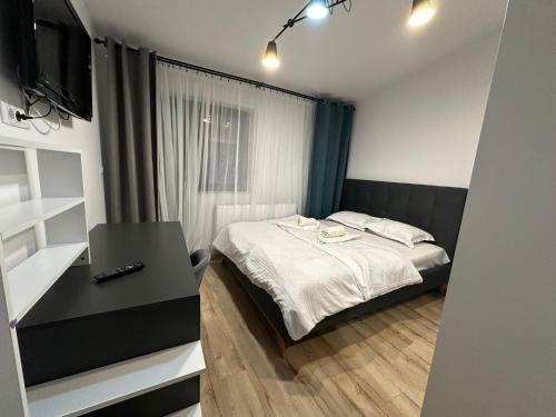 Giường trong phòng chung tại Zlata Comfort Apartment