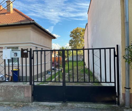 a black gate in front of a building at Cosy art studion in Budapest