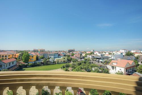 a view of a city from a balcony at Premium CGP Hotel Hoi An in Hoi An