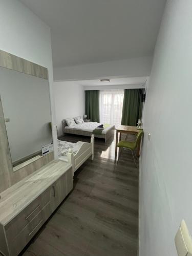 a living room with a large television and a couch at Márti in Odoreu