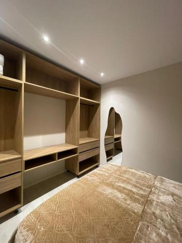 a bedroom with a bed and a chair at Casa Tirana in Tirana