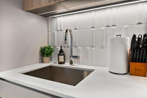 a kitchen counter with a sink in a kitchen at Furnished Apartment in South Boston in Boston