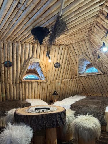 a room with two beds and a table in it at Mała Bawaria in Zakopane