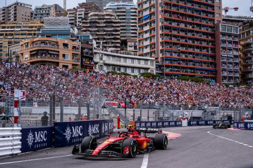 a race car on a track in front of a large crowd at Studio Kialeo près de la plage avec parking voiture in Roquebrune-Cap-Martin