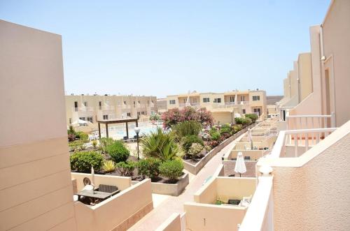 a view from the balcony of a building at Casa Caleta, Beautiful 3-Bed Home, large patio & communal pool in Fuerteventura