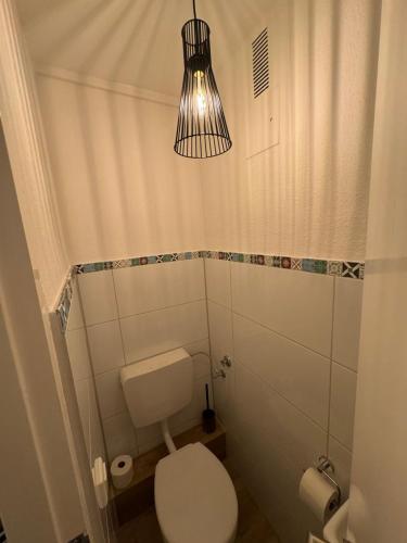 a bathroom with a toilet and a light at Exklusive moderne Ferienwohnung Nr 4 in Kleve - sehr zentral gelegen in Kleve