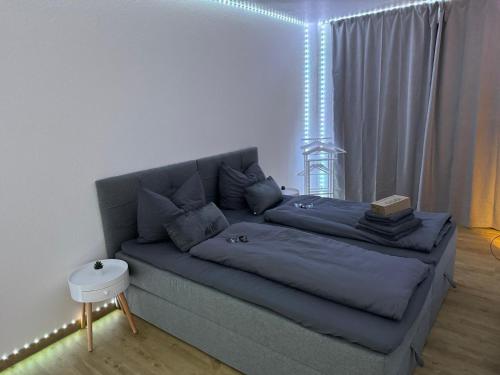 a living room with a couch with lights on it at Exklusive moderne Ferienwohnung Nr 4 in Kleve - sehr zentral gelegen in Kleve