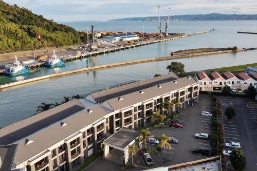 an aerial view of a building next to a marina at NEW! 600m to CBD - Pool in Gisborne