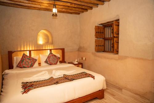 Postel nebo postele na pokoji v ubytování Nomad Inn Nizwa