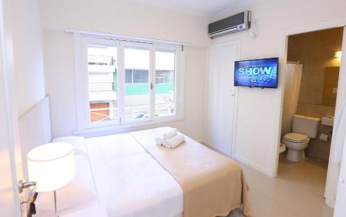 Postel nebo postele na pokoji v ubytování Hotel Acqua