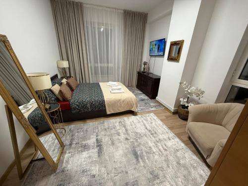 Giường trong phòng chung tại Muha ApartHotel