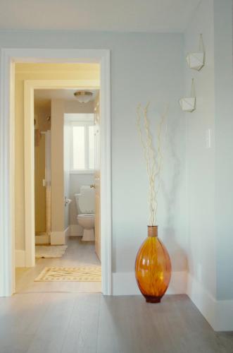 an orange vase sitting on the floor in a hallway at NEW! OSU Campus Stadium Boho Glamour in Corvallis