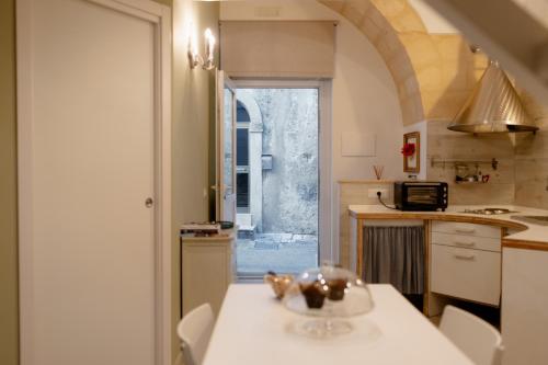 a kitchen with a table with a bowl on it at SASSO BIANCO in Matera