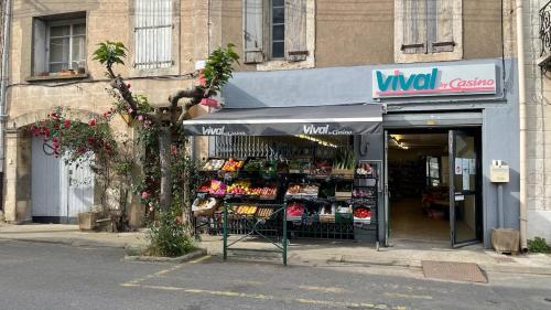 a store front of a store with a sign in front at Modern apartment large terrace and beautiful view in Quarante
