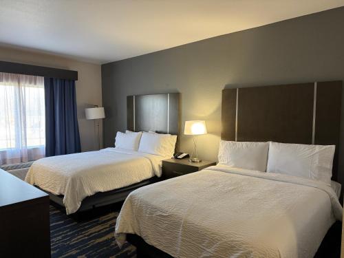 a hotel room with two beds and a window at Garner Hotel Longview South by IHG in Longview