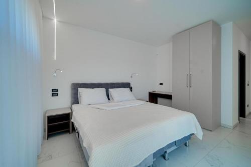 Ένα ή περισσότερα κρεβάτια σε δωμάτιο στο Villa Aurela