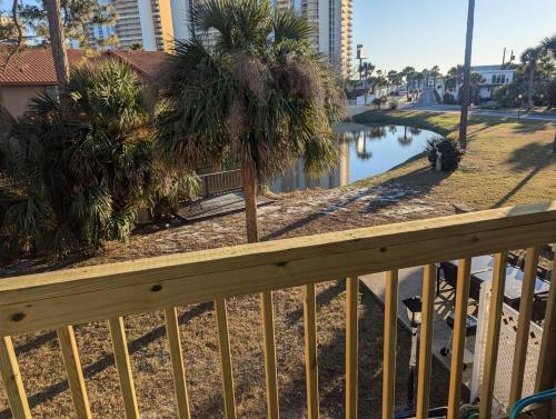 a view of a body of water with palm trees at Double Take! Renovated Vacation Home in Panama City Beach