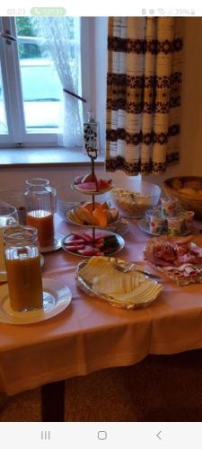a table topped with plates of food on a table at Haus Mühlgraben in Ramsau