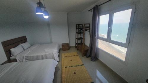 Katil atau katil-katil dalam bilik di Welcome sea view - families only