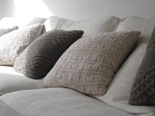 a white couch with four pillows on it at Apartment Perfect Holiday in Jávea