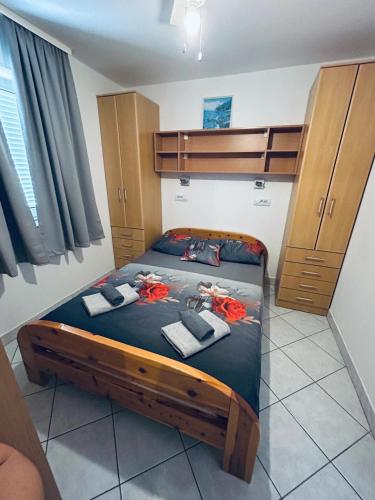 a bedroom with a bunk bed with towels on it at Cosy apartment in Pag / 26 m² / Sea view in Pag