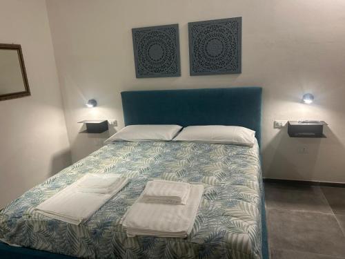 Postel nebo postele na pokoji v ubytování Casa Vacanze Villino Lipari Marsala laguna dello stagnone