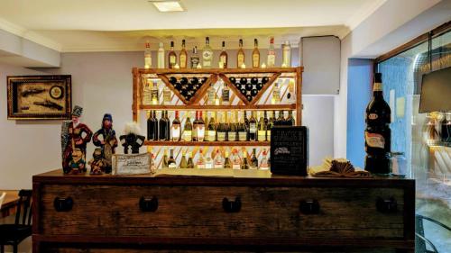 a bar with a lot of bottles of wine at Shara Hotel in Mestia