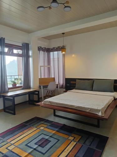 Postel nebo postele na pokoji v ubytování SkyRidge Homestay