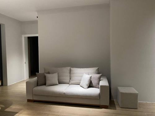 a white couch sitting in a living room at L&vHOUSE in Dilijan