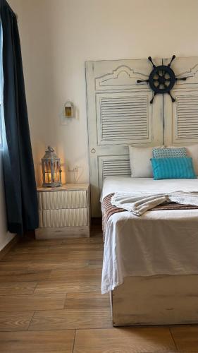 a bedroom with a bed and a lamp on a wooden floor at Coco Rio Hotel - Mamitas Beach Area in Playa del Carmen