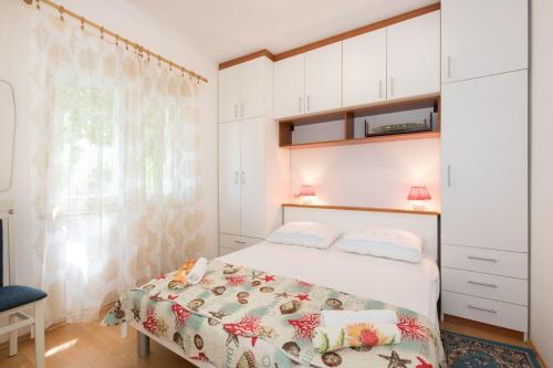 Postel nebo postele na pokoji v ubytování Apartments Kate