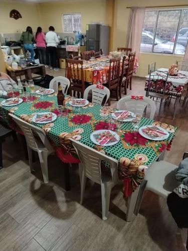 a table with plates of food on top of it at Quinta Los Ángeles in Riobamba