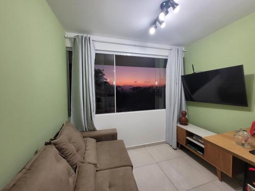 Un televizor și/sau centru de divertisment la Flat topo da montanha 506