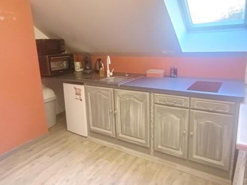 Kuchyň nebo kuchyňský kout v ubytování Gîte Ha-Py Cocon