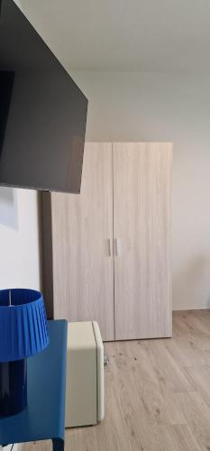 a living room with a couch and a cupboard at marte rooms in Centola