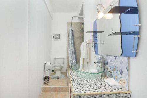 a bathroom with a sink and a toilet in a room at 876 Oasis in Content
