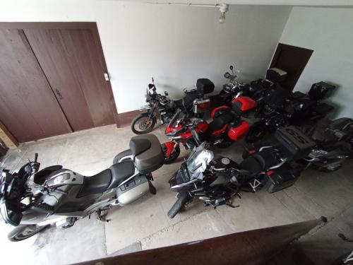 a group of motorcycles parked in a garage at Domaine de la Moselle in Saint-Maurice-sur-Moselle