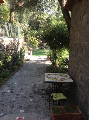 a table and two chairs sitting on a patio at La Dimora le Fumarole Rooms in Ercolano